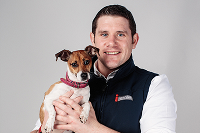Colm O'Loughlin holding a dog